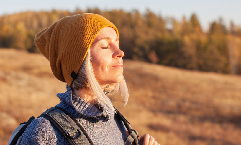 woman out walking - facing the sun light