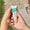 person holding Oy Clear Skin Purifying Serum tube