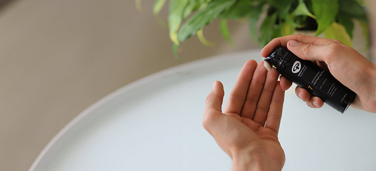 banner for organic toiletries for men category featuring man using skin cream