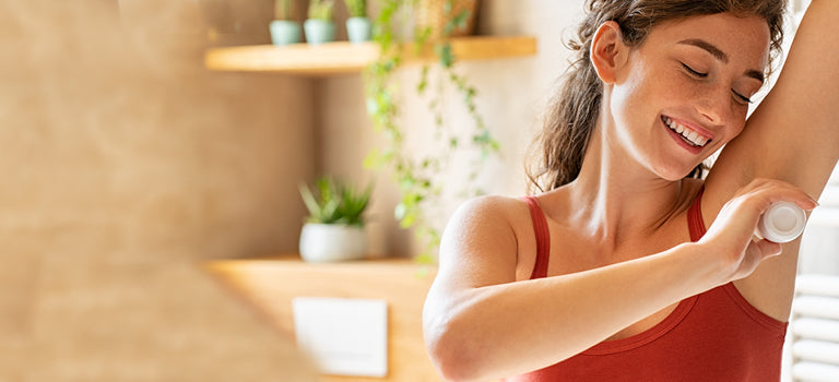 woman applying fragrance free deoodorant