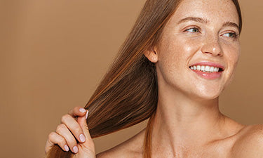 banner for natural conditioner category with woman holding her shiny hair