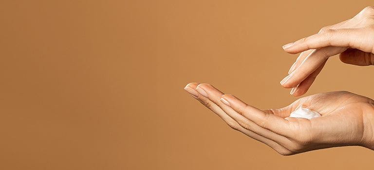 woman applying natural hand care products