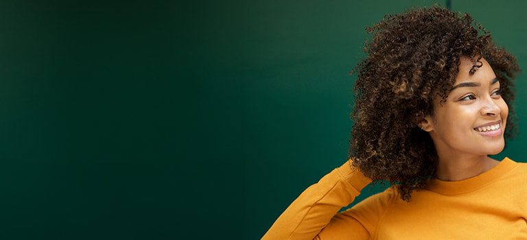 image for pregnancy safe shampoo category featuring woman with curly hair