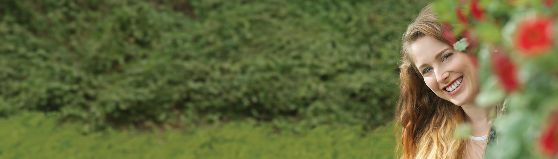 image for pregnancy safe toothpaste category featuring woman smiling in garden