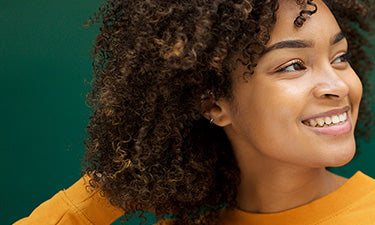 image for silicone free shampoo category featuring woman with curly hair