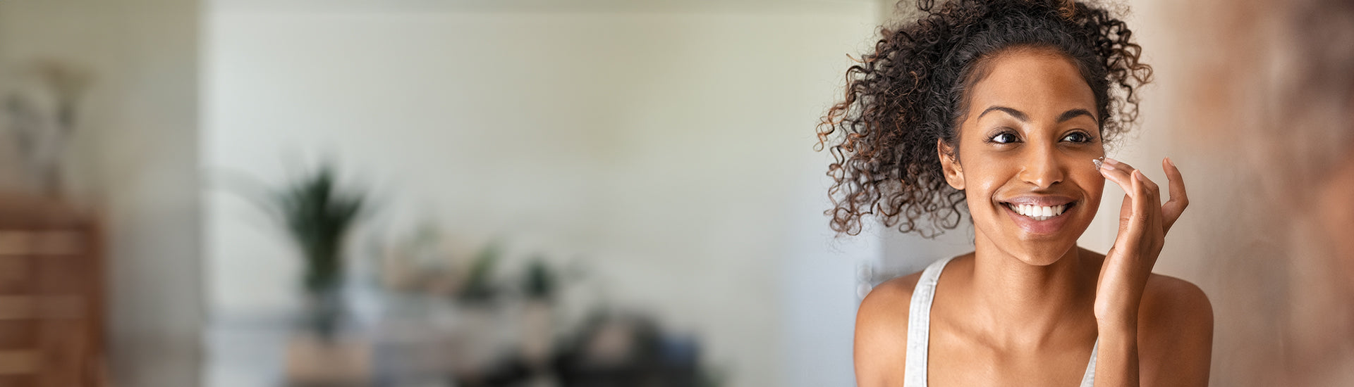 woman applying vegan, cruelty free face wash