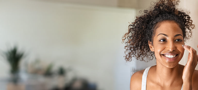 woman applying vegan, cruelty free face wash